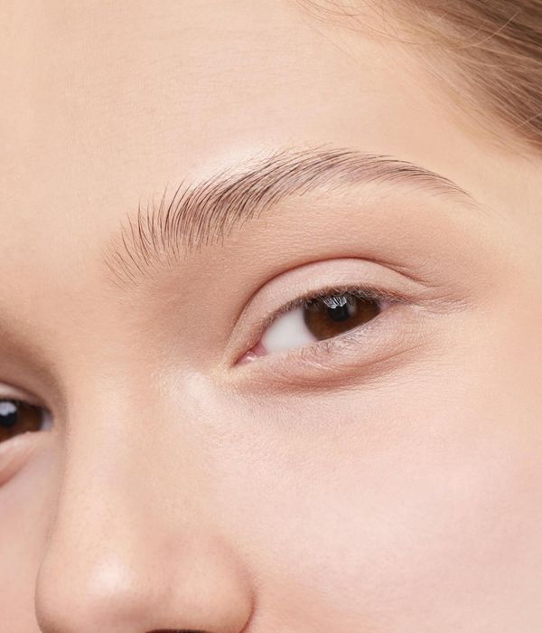 A serene woman looking into the distance with clarity